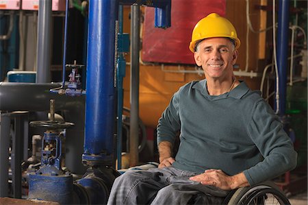 disability, adult, - Power plant engineer with spinal cord injury in demineralization process room Foto de stock - Sin royalties Premium, Código: 6105-07744444