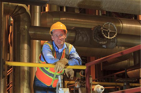 Engineer in electric power plant condenser room Fotografie stock - Premium Royalty-Free, Codice: 6105-07744453