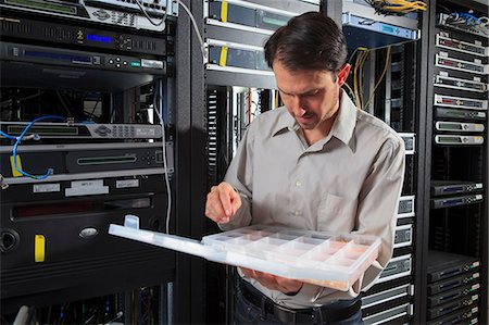 data center person - Network engineer selecting parts for coaxial cables Stock Photo - Premium Royalty-Free, Code: 6105-07744480