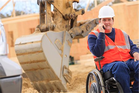 excavations - Construction engineer with spinal cord injury on radio to equipment operator Stock Photo - Premium Royalty-Free, Code: 6105-07744510