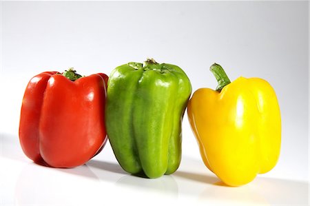 Close-up of bell peppers against white background Stock Photo - Premium Royalty-Free, Code: 6107-06117469