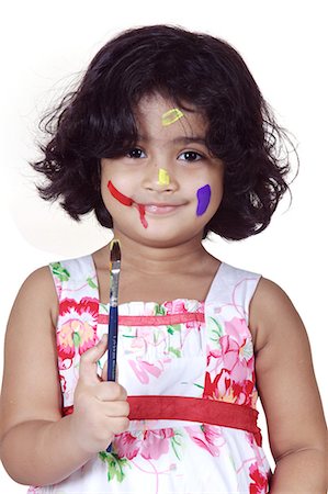 dirty - Portrait of a girl with paint brush Stock Photo - Premium Royalty-Free, Code: 6107-06117588