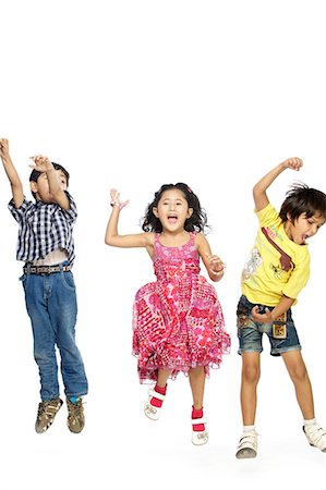 positive - Portrait of three children dancing Stock Photo - Premium Royalty-Free, Code: 6107-06117774