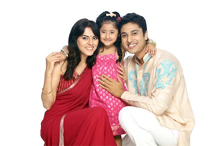 parents couple indian - Parents with daughter smiling Foto de stock - Sin royalties Premium, Código: 6107-06117848