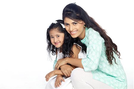 Portrait of mother and daughter smiling Stock Photo - Premium Royalty-Free, Code: 6107-06117862