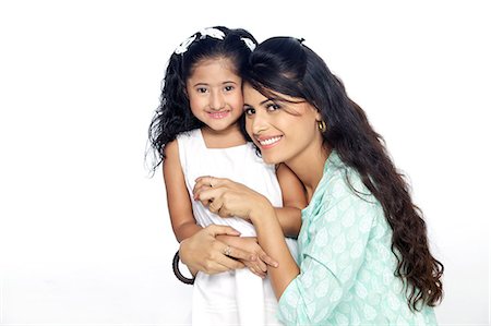 Portrait of mother and daughter smiling Stock Photo - Premium Royalty-Free, Code: 6107-06117869