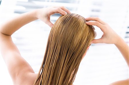 simsearch:6108-05855781,k - Young woman with wet hair, view from the back, close up (studio) Stock Photo - Premium Royalty-Free, Code: 6108-05855809