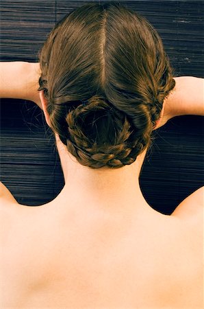 Woman lying on floor, naked shoulders, view from above Fotografie stock - Premium Royalty-Free, Codice: 6108-05855980