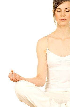 spiritualité - Jeune femme assise, attitude d'yoga, fermé les yeux, gros plan Photographie de stock - Premium Libres de Droits, Code: 6108-05855923