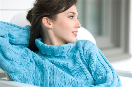 simsearch:6108-05856512,k - Young woman in blue pullover, looking away, outdoors Stock Photo - Premium Royalty-Free, Code: 6108-05856439