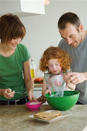 desserts on display - Couple and little girl cooking Stock Photo - Premium Royalty-Free, Code: 6108-05856642