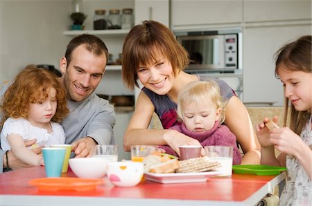 family kitchen - Couple and 3 children having breakfast Stock Photo - Premium Royalty-Free, Code: 6108-05856600