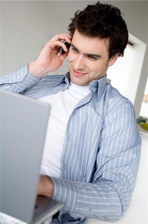 simsearch:6108-05858720,k - Man using laptop computer and mobile phone Stock Photo - Premium Royalty-Free, Code: 6108-05856821