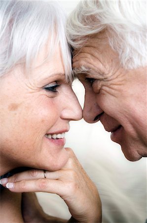 Smiling senior couple face to face, close-up Stock Photo - Premium Royalty-Free, Code: 6108-05856907