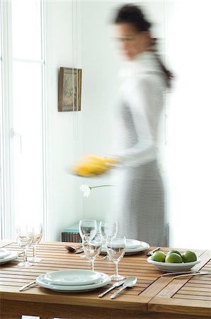 setting table and one person - Woman setting the table Stock Photo - Premium Royalty-Free, Code: 6108-05857076
