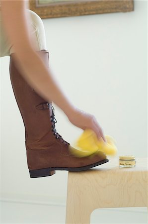 shoe hand - Woman polishing boots, close-up Stock Photo - Premium Royalty-Free, Code: 6108-05857121