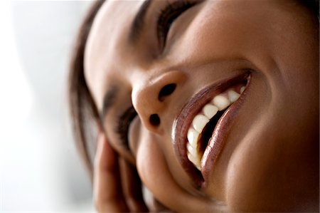 emotion - Portrait of a young smiling woman Stock Photo - Premium Royalty-Free, Code: 6108-05857395