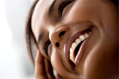 shining hair - Portrait of a young smiling woman Stock Photo - Premium Royalty-Free, Code: 6108-05857395