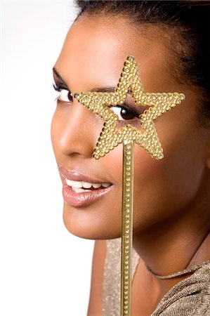 estrella (mujer) - Portrait of a young woman looking through magic wand Foto de stock - Sin royalties Premium, Código: 6108-05857445