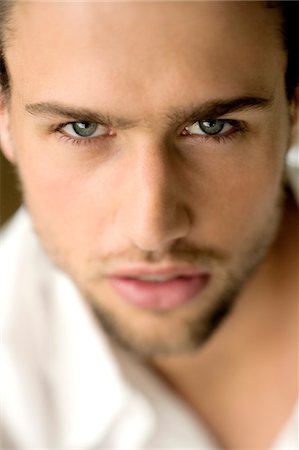Premium Photo  Portrait of young attractive man with blue eyes