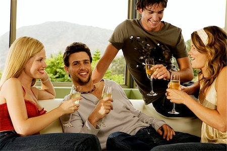 sparkling wine - 2 young couples drinking champagne Stock Photo - Premium Royalty-Free, Code: 6108-05857888