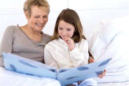 Person looking photo album Stock Photos - Page 1 : Masterfile