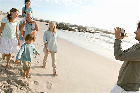 daughter on dads shoulder - Family on the beach Stock Photo - Premium Royalty-Free, Code: 6108-05858225