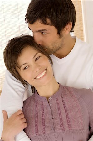 Young couple embracing Stock Photo - Premium Royalty-Free, Code: 6108-05858995