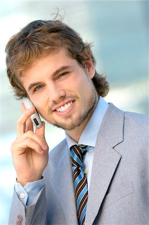 simsearch:6108-05859384,k - Young businessman using mobile phone, portrait Stock Photo - Premium Royalty-Free, Code: 6108-05859253