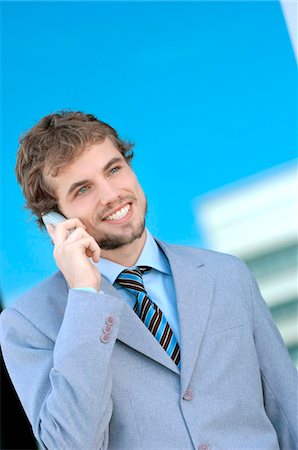 simsearch:6108-05859384,k - Young businessman using mobile phone Stock Photo - Premium Royalty-Free, Code: 6108-05859261