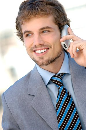 simsearch:6108-05859384,k - Businessman using mobile phone, smiling Stock Photo - Premium Royalty-Free, Code: 6108-05859233