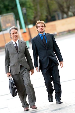 simsearch:6108-05859384,k - Businessmen walking on street Stock Photo - Premium Royalty-Free, Code: 6108-05859417