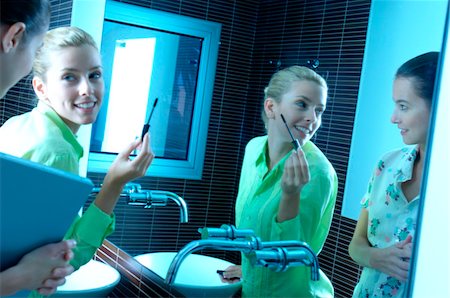 Businesswomen in washroom Stock Photo - Premium Royalty-Free, Code: 6108-05859562