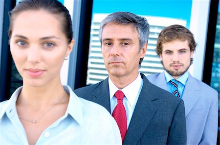 Business people standing in row, portrait Stock Photo - Premium Royalty-Free, Code: 6108-05859595