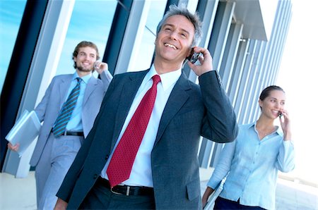 Business people using mobile phone Foto de stock - Sin royalties Premium, Código: 6108-05859514