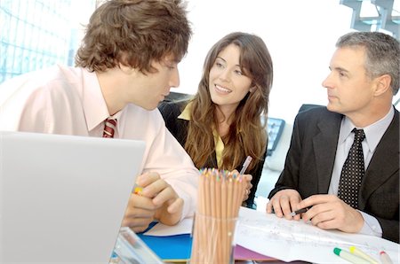 simsearch:6108-05859321,k - Business people discussing in office, smiling Stock Photo - Premium Royalty-Free, Code: 6108-05859535