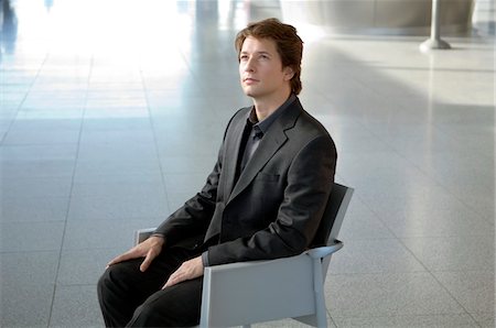 shine floor - Businessman sitting in an armchair Stock Photo - Premium Royalty-Free, Code: 6108-05859653