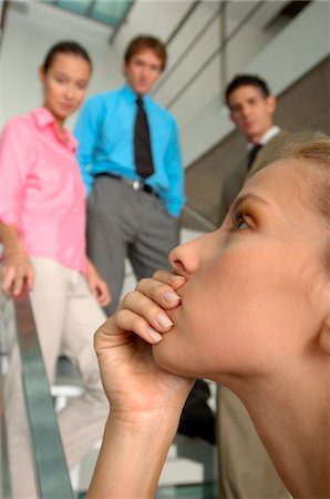 stair close up - Businesswoman with colleagues standing in background Stock Photo - Premium Royalty-Free, Code: 6108-05859619