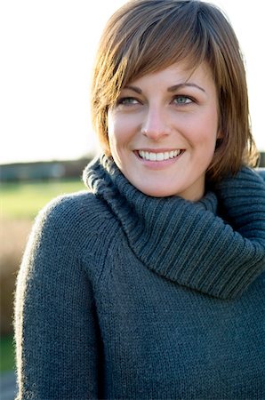 sweaters turtleneck - Close-up of a young woman smiling Stock Photo - Premium Royalty-Free, Code: 6108-05859771