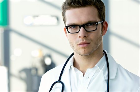 simsearch:6108-05860384,k - Portrait of a male doctor with a stethoscope around his neck Foto de stock - Sin royalties Premium, Código: 6108-05860343