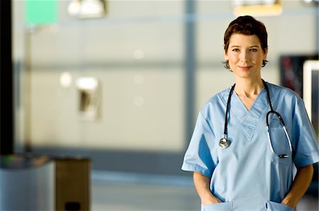 simsearch:6108-05860439,k - Portrait of a female doctor smiling Stock Photo - Premium Royalty-Free, Code: 6108-05860372