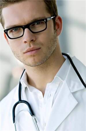 simsearch:6108-05860384,k - Portrait of a male doctor with a stethoscope around his neck Foto de stock - Sin royalties Premium, Código: 6108-05860389