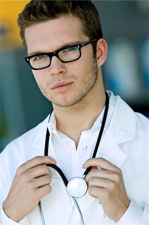 simsearch:6108-05860384,k - Portrait of a male doctor with a stethoscope around his neck Foto de stock - Sin royalties Premium, Código: 6108-05860402