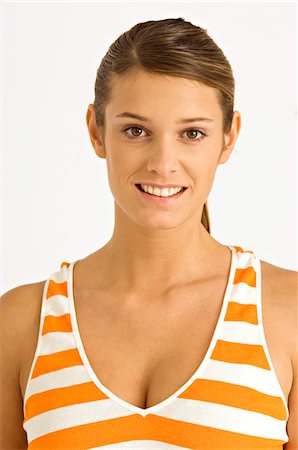 rayure - Portrait d'une jeune femme souriante Photographie de stock - Premium Libres de Droits, Code: 6108-05860885
