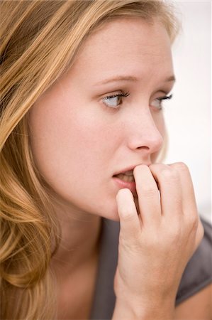 Close-up of a woman thinking Fotografie stock - Premium Royalty-Free, Codice: 6108-05861814