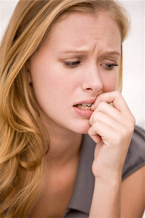 Close-up of a woman thinking Stock Photo - Premium Royalty-Free, Code: 6108-05861835