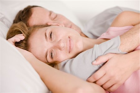 Couple sleeping on the bed Stock Photo - Premium Royalty-Free, Code: 6108-05862072
