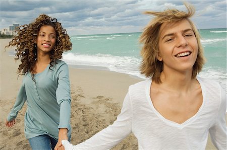 simsearch:614-06896791,k - Teenage boy holding hand of a girl on the beach Stock Photo - Premium Royalty-Free, Code: 6108-05862025