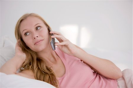 Woman talking on a mobile phone Stock Photo - Premium Royalty-Free, Code: 6108-05862180
