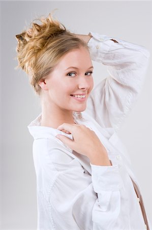 Portrait of a woman smiling Stock Photo - Premium Royalty-Free, Code: 6108-05862458